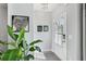 Bright foyer with stylish decor, including a leafy plant and wall art at 2424 Lakeshore Se Ln, Atlanta, GA 30316