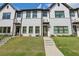 Beautiful townhome featuring a modern exterior, lovely landscaping, and inviting entryway at 2424 Lakeshore Se Ln, Atlanta, GA 30316