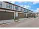 Attached garages with large doors on a row of townhomes at 2424 Lakeshore Se Ln, Atlanta, GA 30316