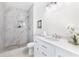 Elegant bathroom featuring a tiled shower, modern vanity, and stylish fixtures at 5232 W Mountain St, Stone Mountain, GA 30083