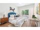 Comfortable bedroom featuring natural light and a sliding door leading to the outdoors at 5232 W Mountain St, Stone Mountain, GA 30083