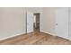 Bedroom with closet and doorway to the bathroom and tile flooring at 5232 W Mountain St, Stone Mountain, GA 30083