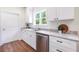 Bright, modern kitchen featuring granite countertops, stainless steel appliances, and ample cabinet space at 5232 W Mountain St, Stone Mountain, GA 30083