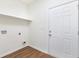 A well-lit laundry room with a shelf and a utility connections for your washer and dryer at 5232 W Mountain St, Stone Mountain, GA 30083