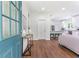 Inviting entry view into the open-concept living space and bright kitchen beyond at 5232 W Mountain St, Stone Mountain, GA 30083