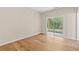 Living room with hardwood floors and access to backyard at 5232 W Mountain St, Stone Mountain, GA 30083