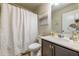 Bathroom with a single sink vanity, a shower curtain, and a decorative mirror at 7144 Gladstone Cir, Stonecrest, GA 30038