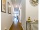 Inviting hallway with beautiful decor, gleaming hardwood floors, and ample natural light at 7144 Gladstone Cir, Stonecrest, GA 30038
