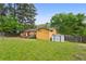 Large backyard with a deck, shed, and plenty of green space for recreation and gardening at 2529 Ridgecrest Nw Dr, Kennesaw, GA 30152