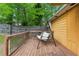Relaxing backyard deck features an outdoor swing, perfect for enjoying the serene view at 2529 Ridgecrest Nw Dr, Kennesaw, GA 30152