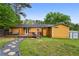 Well-maintained backyard with a stone pathway, decks, and ample space for outdoor activities at 2529 Ridgecrest Nw Dr, Kennesaw, GA 30152