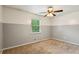 Comfortable bedroom featuring a ceiling fan and two-tone paint at 2529 Ridgecrest Nw Dr, Kennesaw, GA 30152