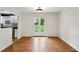 Bright dining area with hardwood floors and white french doors that lead to the backyard at 2529 Ridgecrest Nw Dr, Kennesaw, GA 30152