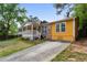 View of a charming single-story home with a long driveway and a welcoming front porch at 2529 Ridgecrest Nw Dr, Kennesaw, GA 30152
