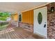 Covered front porch with brick accents offering a cozy outdoor space at 2529 Ridgecrest Nw Dr, Kennesaw, GA 30152