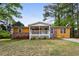 Charming single-story home featuring a welcoming front porch and a well-maintained lawn at 2529 Ridgecrest Nw Dr, Kennesaw, GA 30152