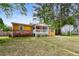 Single-story home with a front porch, well-maintained lawn, and lush landscaping at 2529 Ridgecrest Nw Dr, Kennesaw, GA 30152