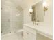 Well-lit bathroom with a glass-enclosed shower, modern fixtures, and vanity with lots of counter space at 4059 Yellow Creek Trl, Cumming, GA 30028
