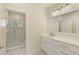 Modern bathroom with a frameless glass shower and a large white vanity at 4059 Yellow Creek Trl, Cumming, GA 30028