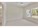 Bright bedroom features neutral carpet and multiple windows offering bright views at 4059 Yellow Creek Trl, Cumming, GA 30028