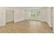 Bright bonus room featuring hardwood floors and large windows offering an abundance of natural light at 4059 Yellow Creek Trl, Cumming, GA 30028