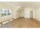 Bright bonus room featuring hardwood floors, recessed lighting and large windows offering wooded views at 4059 Yellow Creek Trl, Cumming, GA 30028