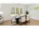 Dining room with modern lighting and natural views at 4059 Yellow Creek Trl, Cumming, GA 30028