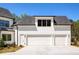 Spacious three-car garage with ample parking and modern design elements at 4059 Yellow Creek Trl, Cumming, GA 30028