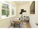 Bright home office with large windows, hardwood floors, and stylish decor at 4059 Yellow Creek Trl, Cumming, GA 30028