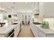 Bright kitchen with island, stainless appliances, quartz counters and gas range at 4059 Yellow Creek Trl, Cumming, GA 30028