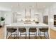 Bright kitchen with island, pendant lighting, stainless appliances and seating at 4059 Yellow Creek Trl, Cumming, GA 30028