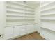 Walk-in pantry with custom cabinets and shelving at 4059 Yellow Creek Trl, Cumming, GA 30028