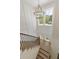 Grand staircase with an oversized window offers an abundance of natural light at 4059 Yellow Creek Trl, Cumming, GA 30028