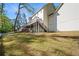Spacious backyard of home with large deck perfect for outdoor entertaining, featuring green lawn at 4477 Jett Nw Rd, Atlanta, GA 30327
