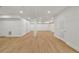 Spacious basement featuring wood-look floors and recessed lighting throughout the open living area at 4477 Jett Nw Rd, Atlanta, GA 30327