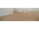 Bright basement featuring wood-look floors and recessed lighting throughout open living area at 4477 Jett Nw Rd, Atlanta, GA 30327