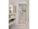 Elegant bathroom featuring a glass shower, marble tiling, and a built-in shelf at 4477 Jett Nw Rd, Atlanta, GA 30327
