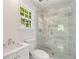 Clean bathroom featuring marble tile flooring, glass shower, and vanity sink at 4477 Jett Nw Rd, Atlanta, GA 30327
