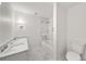 Modern bathroom featuring marble tile flooring, large tub and double sinks at 4477 Jett Nw Rd, Atlanta, GA 30327