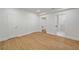 Bedroom featuring wood-look floors with ensuite bath and walk-in closet at 4477 Jett Nw Rd, Atlanta, GA 30327