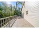 Spacious deck on side of house with lush backyard views and white railing at 4477 Jett Nw Rd, Atlanta, GA 30327