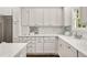 Bright kitchen featuring white cabinetry, marble countertops, and subway tile backsplash at 4477 Jett Nw Rd, Atlanta, GA 30327