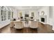 Bright and airy living room with hardwood floors, large windows, and fireplace at 4477 Jett Nw Rd, Atlanta, GA 30327