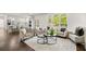 Open-concept living space showcasing kitchen, living room, and large windows at 4477 Jett Nw Rd, Atlanta, GA 30327