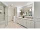 Luxurious main bathroom with double vanity, granite countertops, and a spacious glass-enclosed shower at 4477 Jett Nw Rd, Atlanta, GA 30327