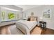 Serene main bedroom with bay window, window seat, shutters, and plenty of natural light at 4477 Jett Nw Rd, Atlanta, GA 30327