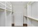 Well-organized walk-in closet with custom shelving and a built-in dresser for optimal storage at 4477 Jett Nw Rd, Atlanta, GA 30327