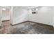 Basement space with concrete floors, a window, and access to another room at 3826 Ensign Dr, Chamblee, GA 30341