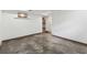 Basement space featuring concrete floors, white walls, and access to adjacent rooms at 3826 Ensign Dr, Chamblee, GA 30341