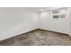 Empty basement space with concrete floors, white walls, and a window at 3826 Ensign Dr, Chamblee, GA 30341